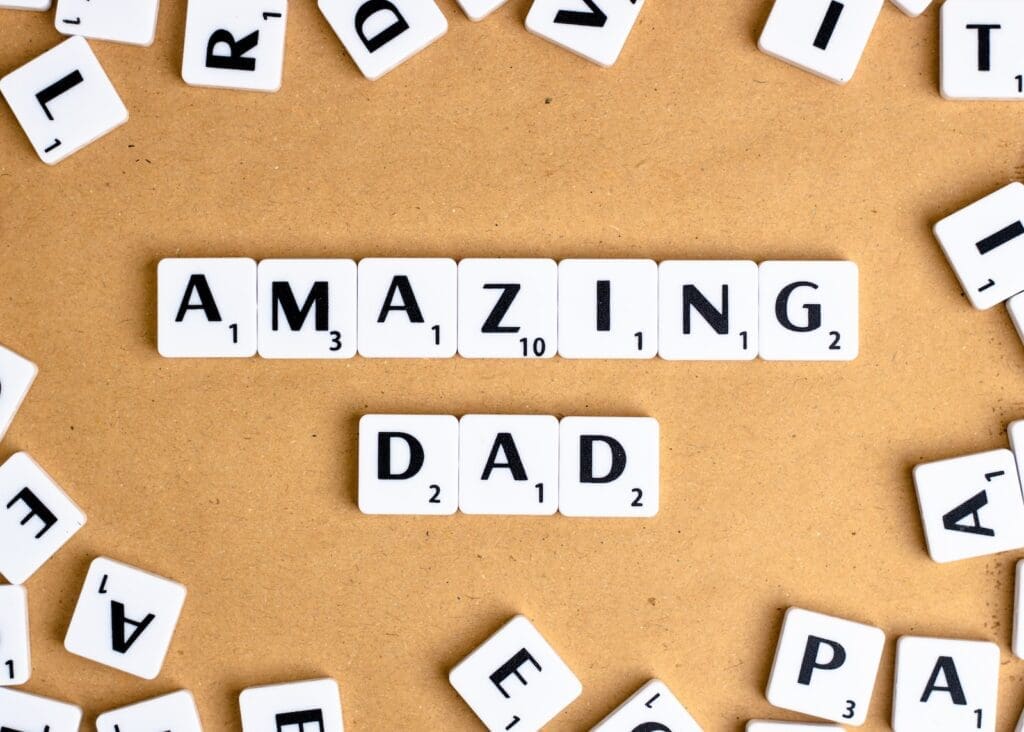 Father's Day.white and black letter blocks on brown surface