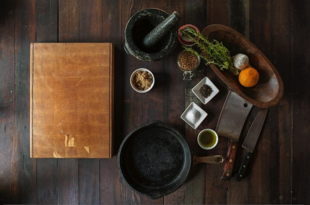 Defining global food trend: black mortar and pestle beside brown box in top view photography